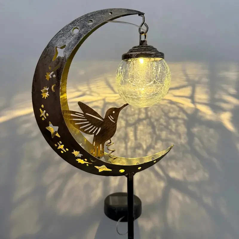 SolarBird – Solar-powered crescent garden light with bird design