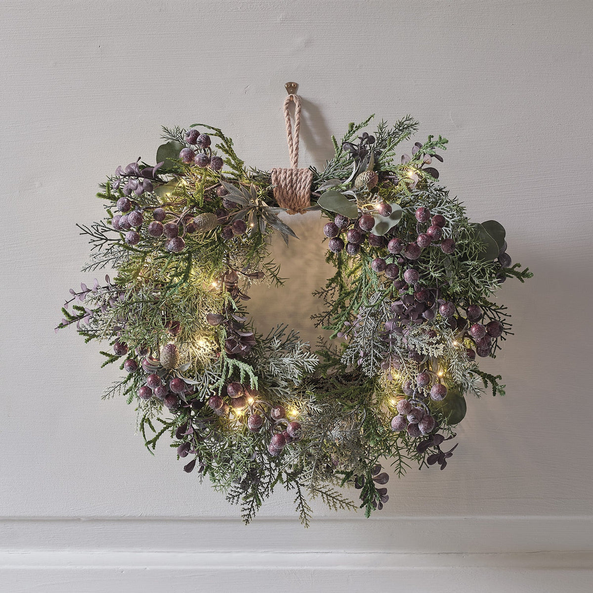 Heart-shaped wreath illuminated with purple berries – 40 cm