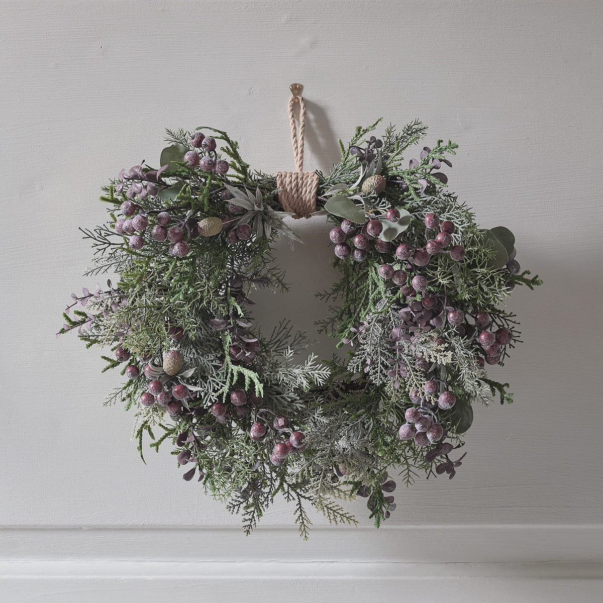 Heart-shaped wreath illuminated with purple berries – 40 cm