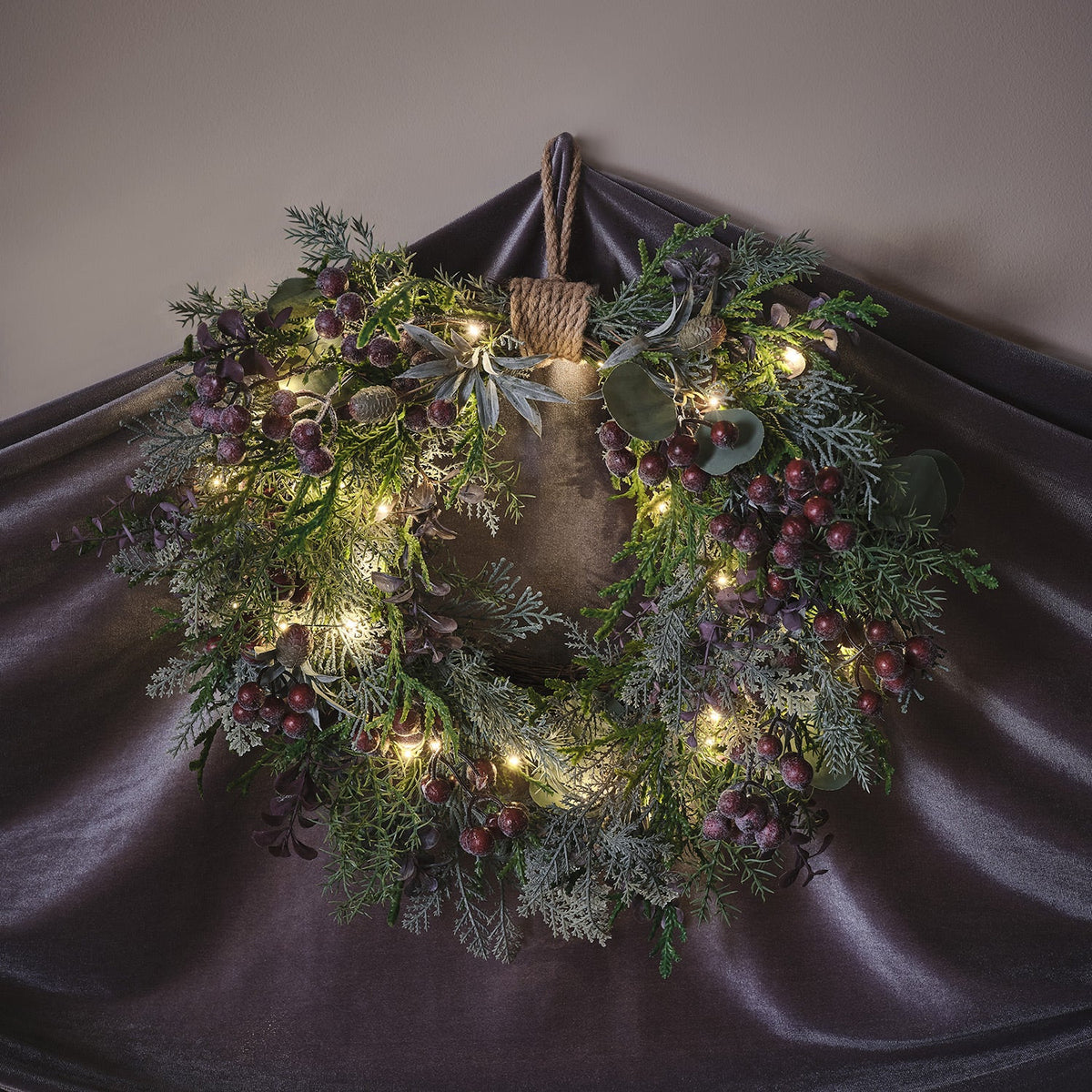 Heart-shaped wreath illuminated with purple berries – 40 cm