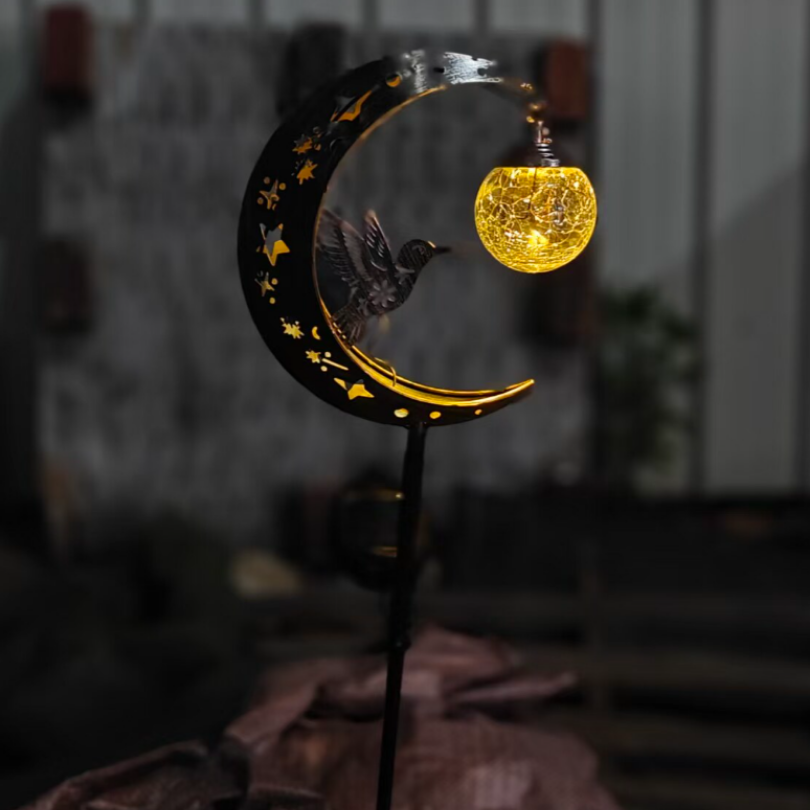 SolarBird – Solar-powered crescent garden light with bird design